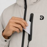 Lightweight packable running jacket featuring hood storage pocket and waterproof front zipper.