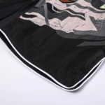 Custom sublimation mma shorts in black and grey with distressed geometric graphics for boxing and grappling