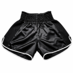Black mesh panel muay thai shorts in custom satin with white piping and elastic waistband